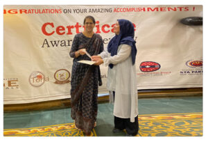 Outstanding student receiving the Baking Art Award from Cabrini University during a formal ceremony.