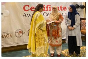 5. Students in baking and cooking arts are awarded certificates, showcasing their achievements in a graduation setting.